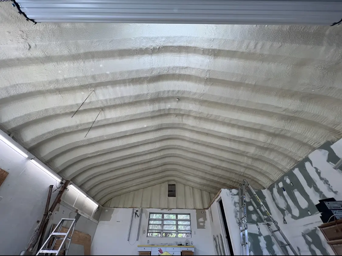Spray polyurethane foam applied to the underside of a metal roof deck in Gateway